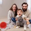 Happy family playing together at home with their baby son Equipo profesional de limpieza en Mataró realizando servicios a domicilio